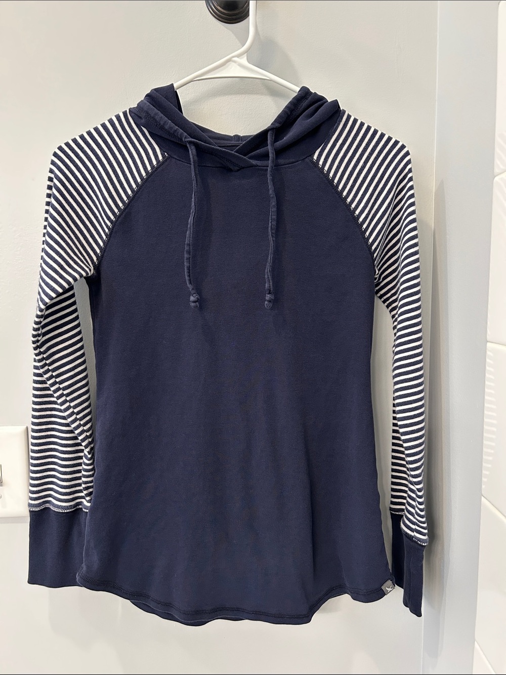 Navy Hoodie with Striped Raglan Sleeves. Lightweight cotton material.